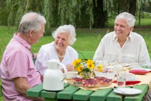 Seniors enjoying a picnic outdoors