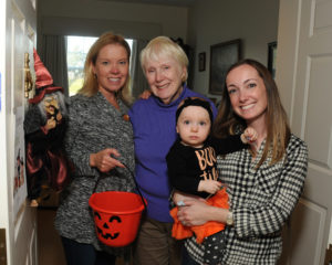 Halloween is a family affair at Allerton House at Central Park. Resident Liz Bardsley is greeted by her daughter Lisa Davison (left) her granddaughter, Kari Gilbert (right) and Ms. Bardsley’s great-granddaughter, Sophie, 13 months.