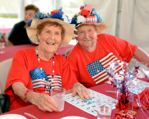 Helen McHugh (left) and Ruth Sheridan enjoy the annual Allerton House in Weymouth summer cookout.