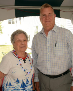 Marketing Director Al Ewing enjoys greeting the COA members. Here, Al joins Ann Malcolm for a photograph under the tent.