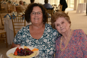 Kindred spirits capture the moment at the Welch Senior Living Assisted Living Week Luncheon. Deborah Cassidy, activities assistant at Allerton House in Weymouth pauses to take a photograph with resident Doris Wheeling.